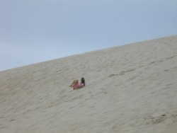 Photo of tobogganing down a dune (photos by Caroline Wenger). Photo of tobogganing down a dune (photos by Caroline Wenger).
