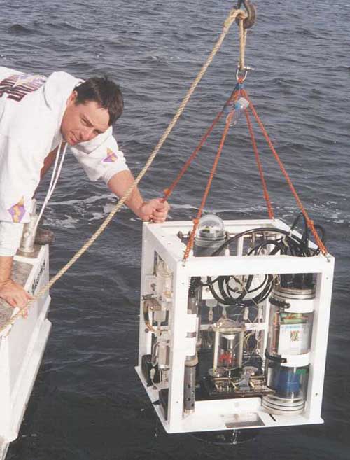 Photo of a benthic chamber being deployed Photo of a benthic chamber being deployed
