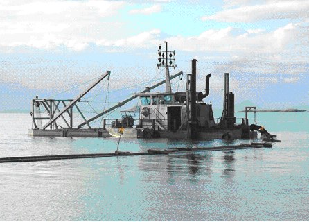 Photo showing Small dredge vessel pumping sand from the entrance of a boat harbour. Esperance, Western Australia. Photo showing Small dredge vessel pumping sand from the entrance of a boat harbour. Esperance, Western Australia.